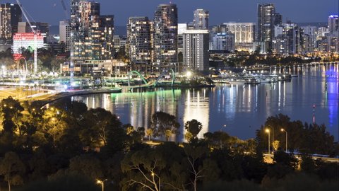 Perth central business district during night time lapse showing city with Elizabeth Quay and ferries on swan river. Western Australia Tourism.