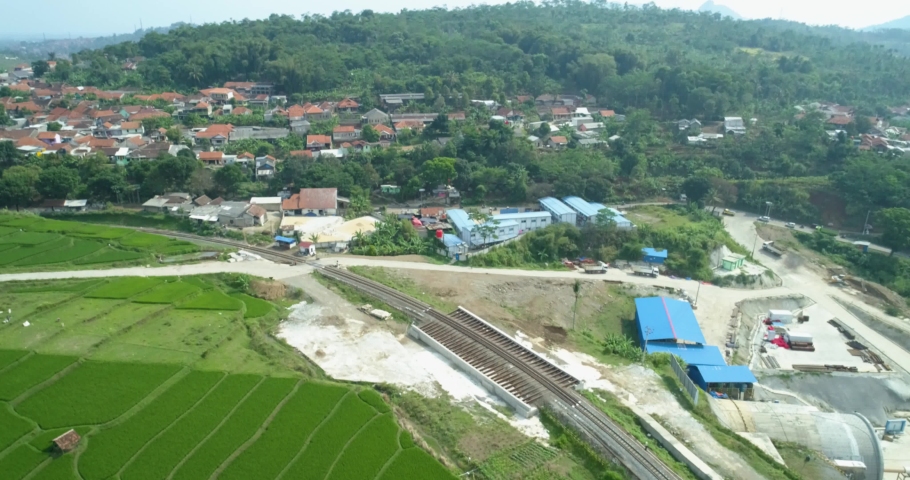 Scenic aerial view of jakarta bandung high speed train construction project  near cimeta bridge and cipularang toll road, padalarang bandung, indonesia