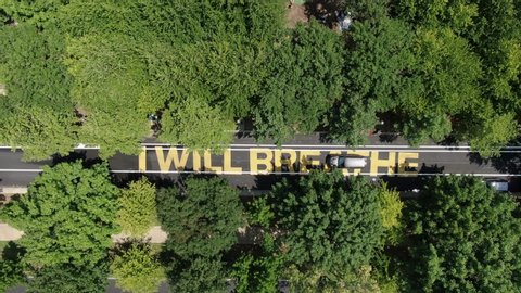 Aerial of I Will Breathe painted on street in United States, response to George Floyd death, police brutality in America, I Can't Breathe famous quote