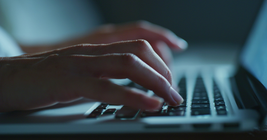Close up shot of an young business woman's hands busy working on laptop or computer keyboard for send emails and surf on a web browser late hour at night. Royalty-Free Stock Footage #1057929418