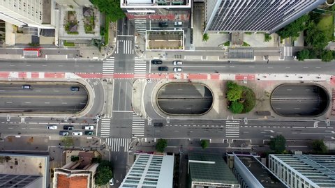 Top Down View of Intersection of famous avenues in Brazil. Paulista  and Consolacao Avenues. Transportation Scene. Aerial View of Traffic and Pedestrian on Crosswalk. Aerial Landscape of Sao Paulo