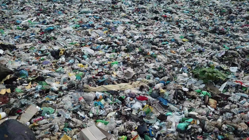 Marine garbage, landfill, garbage brought by the ocean, garbage platform. The concept of environmental pollution and environmental catastrophe. | Shutterstock HD Video #1057933984