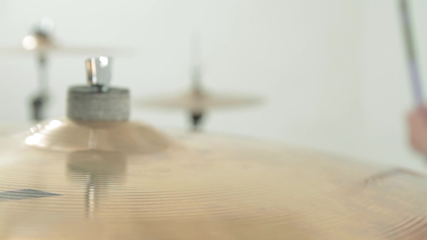 The drummer plays the drum. Four close-up frames on a white background.