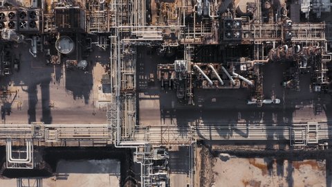 Aerial top view of refinery plant, production line with metal pipes in industry zone