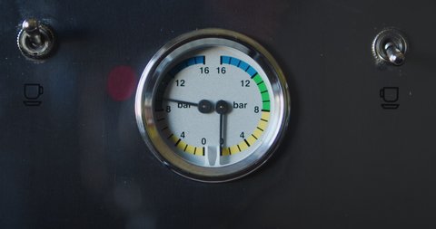 Espresso machine gauge showing nine bars of pressure