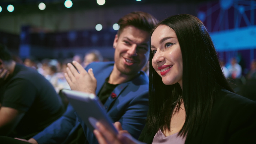 Business audience crowded forum. Persons smiling discussion conference. Woman and man listen speaker auditorium. Viewer business men financial summit . Group people discussing speech in crowd audience