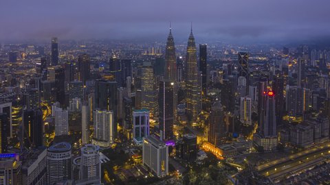 Malaysia Time lapse: Kuala Lumpur aerial view during dawn overlooking KL city skyline in Federal Territory, Malaysia. Prores 4KUHD