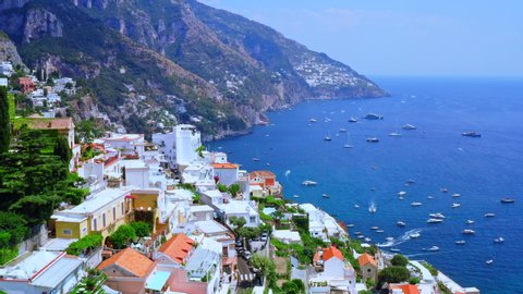 Aerial Drone View of Positano, near Naples, Italy.
Flying Low above Historic White town along the Amalfi Coast Near Salerno. View of the Beach and Beautiful Blue Ocean with boats.