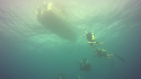 Scuba divers on a safety stop at the end of a dive in Truk Lagoon, Micronesia