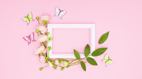 6k Romantic roses with leaves and butterflies surround white frame for text.Stop motion	