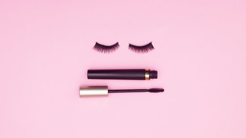 6k Mascara and eye lashes appear on pink theme and lashes blinking. Stop motion	