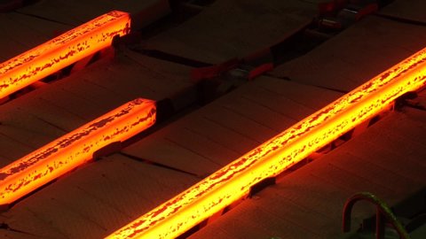 Red hot steel metal billets after molten steel casting. Continuous casting machine. Hot billet (bloom) continuous casting, also called strand casting
