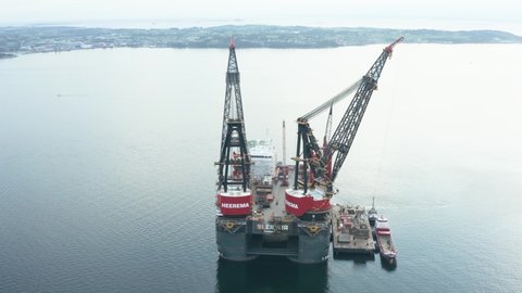Stavanger / Norway - 08 16 2020: Aerial View of Heavy Lifting Crane Platform and Semi Submersible Vessel in Bay. SSCV For Offcoast Construction, Ship Maintenance and Repair
