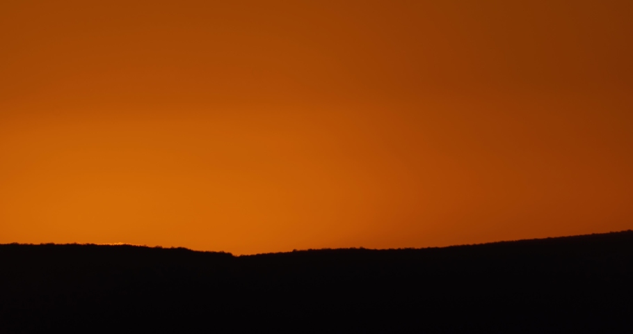 Big sun close-up rising at mountain.	 Beautiful nature video time lapse landscape. | Shutterstock HD Video #1057994425