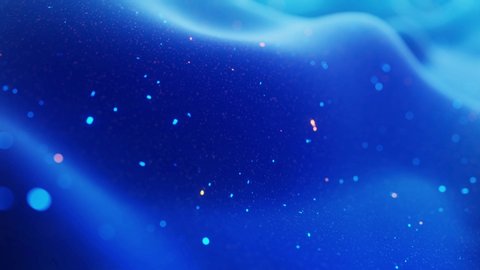 fantastical festive blue bg. Stylish abstract looped background, waves move on matt surface like landscape made of liquid blue wax with sparkles. Beautiful soft background with smooth animation 4k