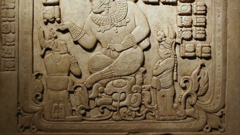 Bas relief depicting a god and people. Copan Ruinas in Honduras, archaeological site of the Maya civilization in the Copán Department of western Honduras, not far from the border with Guatemala.