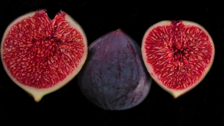 Figs Isolated on black Background. Super slow motion Squeeze Half of Delicate figs.  macro | Shutterstock HD Video #1058012533