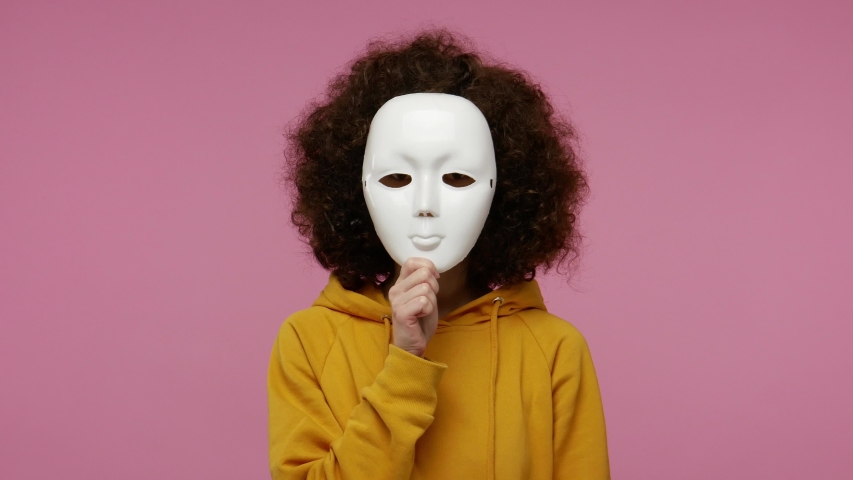 Multiple personality concept. young woman afro hairstyle acting different emotions, taking off mask changing facial expressions of happiness sadness amazement, showing various grimaces.indoor isolated Royalty-Free Stock Footage #1058012824