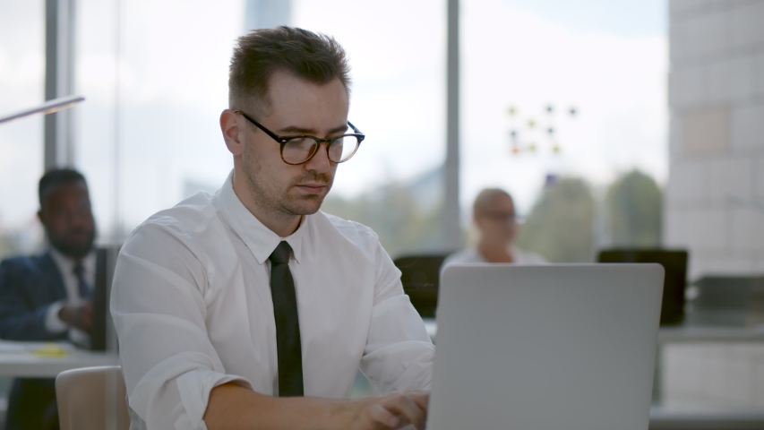 Team leader encourage and pat on shoulder expressing positive successful to young man employee. Executive congratulating or praising worker sitting at desk using laptop in modern office Royalty-Free Stock Footage #1058014222