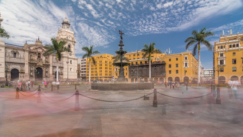 Fountain on The Plaza de Armas timelapse hyperlapse, also known as the Plaza Mayor, sits at the heart of Lima's historic center. Cathedral on a background Royalty-Free Stock Footage #1058016844