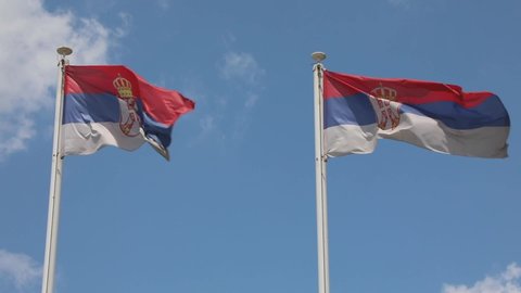 Two National Flags Republic Serbia at Poles Wind