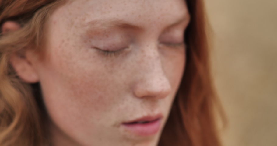 Close up of Woman’s Face, Girl opening her Beautiful blue Eyes, Attractive Ginger. Natural Beauty with Freckles. Gorgeous woman with long Eyelashes and Attractive Appearance. Slow motion. Royalty-Free Stock Footage #1058021584