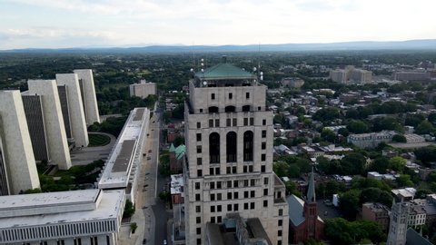 Albany, New York / United States - Aug 22 2020: A circling aerial view of Alfred E. Smith Building located in downtown Albany, New York.