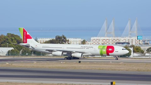 LISBON, PORTUGAL - 2020: TAP Air Airbus A340-300 Jet Airliner Taxiing at Lisbon Humberto Delgado Portela International Airport Ground on a Blue Sky Sunny Day