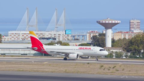 LISBON, PORTUGAL - 2020: Iberia Airbus A320 neo Jet Airliner Taxiing at Lisbon Humberto Delgado Portela International Airport Ground on a Blue Sky Sunny Day