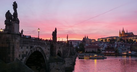 Panoramic view of Prague town, Vltava river and Vitus Cathedral at late evening in Prague, Czech Republic. Panning camera motion.