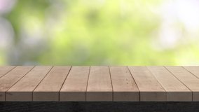 Wood table bar and nature tree bokeh blurred background at morning time and beautiful nature sun light, Top wood table space area for products shows. 3840x2160. 4K UHD. Video Clip.