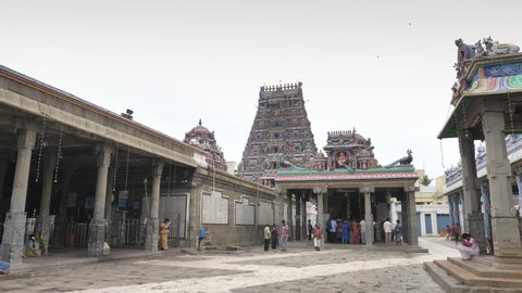 Long shot of the Devotees or people seeking the blessings of the lord Shiva at the ancient Dravidian Hindu temple of Kapaleeshwarar, Chennai, Tamil Nadu, India (February 2020)