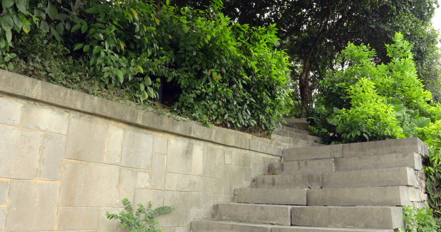 Chinese woman walking down a stone stairway in Guilin China