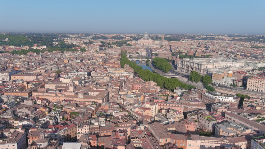 Aerial view of Rome, Castel Sant'Angelo (Castle of the Holy Angel) in foreground and Vatican City in background, bridges over river Tiber - cityscape of capital city of Italy from above, Europe Royalty-Free Stock Footage #1058060323