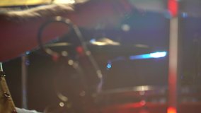 elderly man plays drums during a live concert. Freehand shooting, red and green backlight. ideal for aging concept. New life in retirement - Powered by Shutterstock - Get 15% off with code: PIKWIZARD15