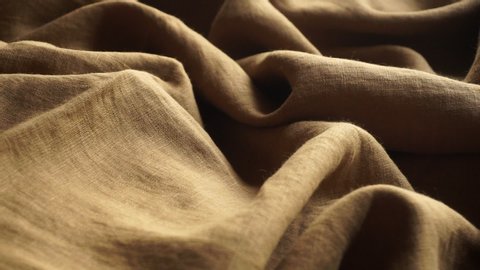 Eco linen fabric background. Production of textile clothing and natural environmentally friendly materials.