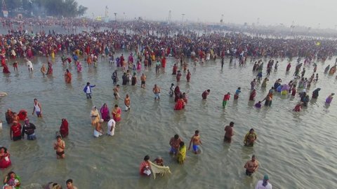 Allahabad, India - 07/12/2019 - Aerial/Drone shot of Kumbh Mela in India.Pilgrims/Devotees taking bath in holy waters of Ganges River.