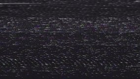 Glitch and VHS effect. Digital pixel black and white noise glitch effect. Digital pixel noise vhs effect. The problems of the video signal of the TV of the 80s and interference on the screen. 4K.