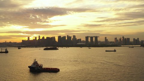 Aerial shot of Singapore city skyline & ships