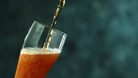 Macro Shot Of Pouring Beer Into Glass, Super Slow Motion at 1000 fps.