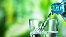 Super slow motion of pouring water from the bottle into a glass. Filmed at 1000 fps. - Powered by Shutterstock - Get 15% off with code: PIKWIZARD15