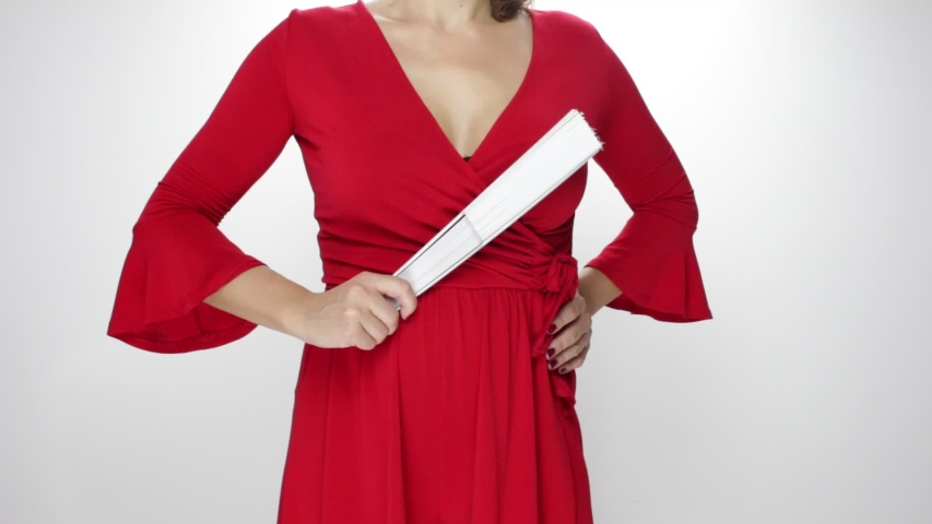 Woman in red dress moving flamenco fan and sevillanas