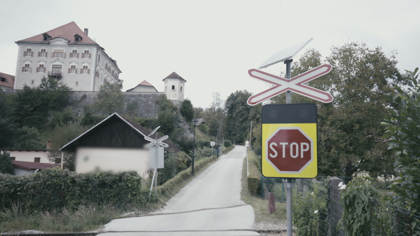 Railroad crossing warning sign with solar panel lights 4K