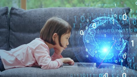 Asian little girl using laptop PC. Education technology. EdTech.