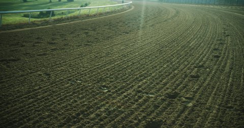 Empty horse racing track. Dollying along the the dirt path.