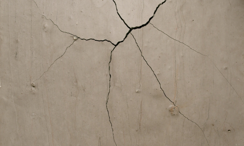 Effect of a brown concrete plaster cracking slowly from the top side from the Impact collection - Debris VFX Video Element. | Shutterstock HD Video #1058140471