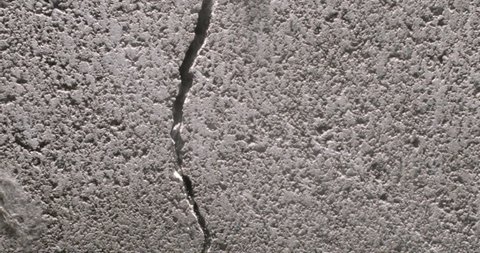 Close up shot of a concrete block cracking from the left side from the Impact collection - Debris VFX Video Element.