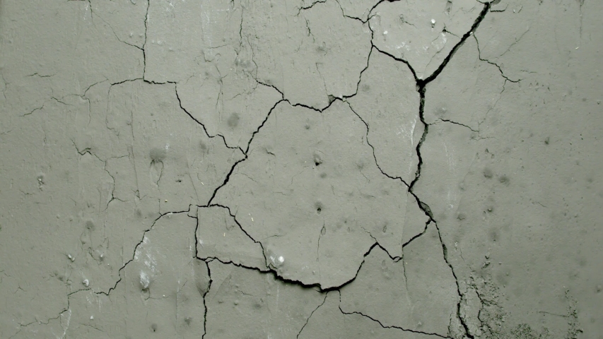Effect of an old grey concrete wall falling back and cracking from the Impact collection - Debris VFX Video Element. | Shutterstock HD Video #1058140573