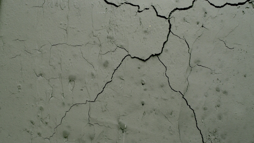 Effect of a grey cracked concrete wall cracking from the top right side from the Impact collection - Debris VFX Video Element. | Shutterstock HD Video #1058140579