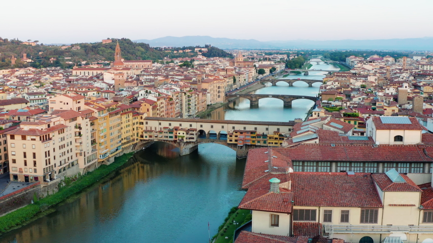 Florence at sunrise, Medieval Ponte Vecchio Aerial View Royalty-Free Stock Footage #1058151787